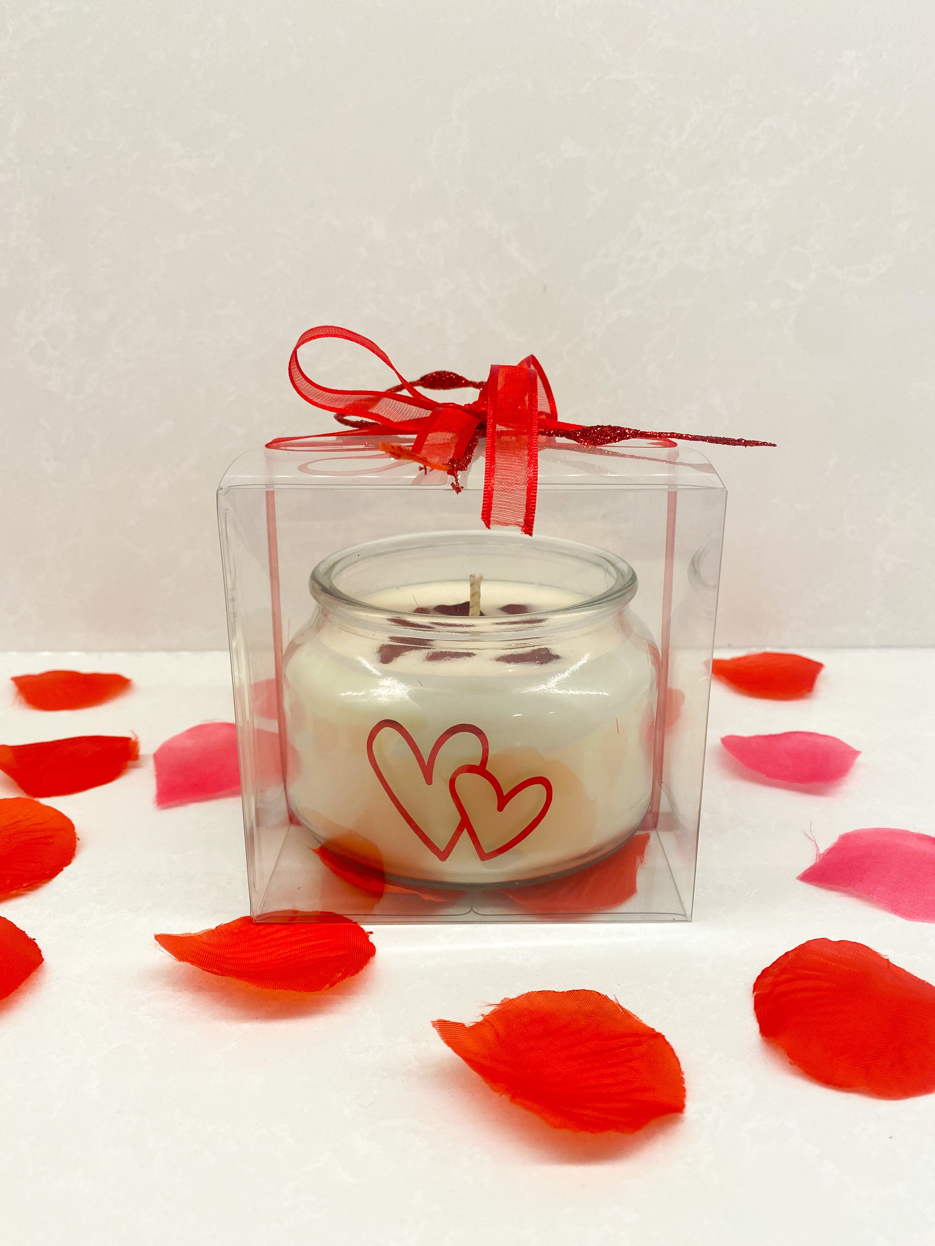 two heart candle in clear box